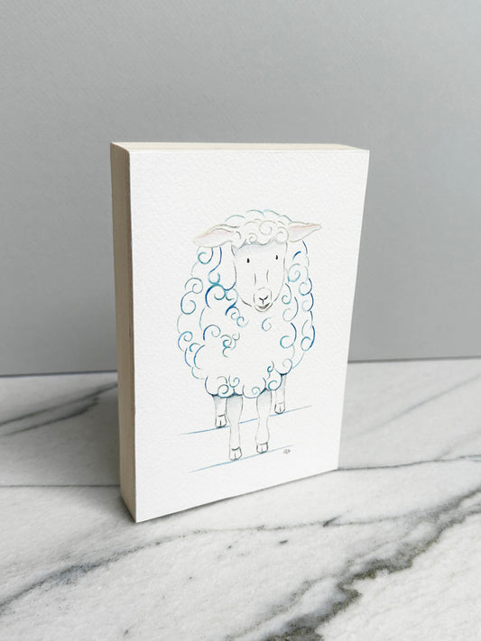 Bella the Sheep, an original watercolor painting of a sheep with soft blue curls, mounted on a cradled wood panel, side view