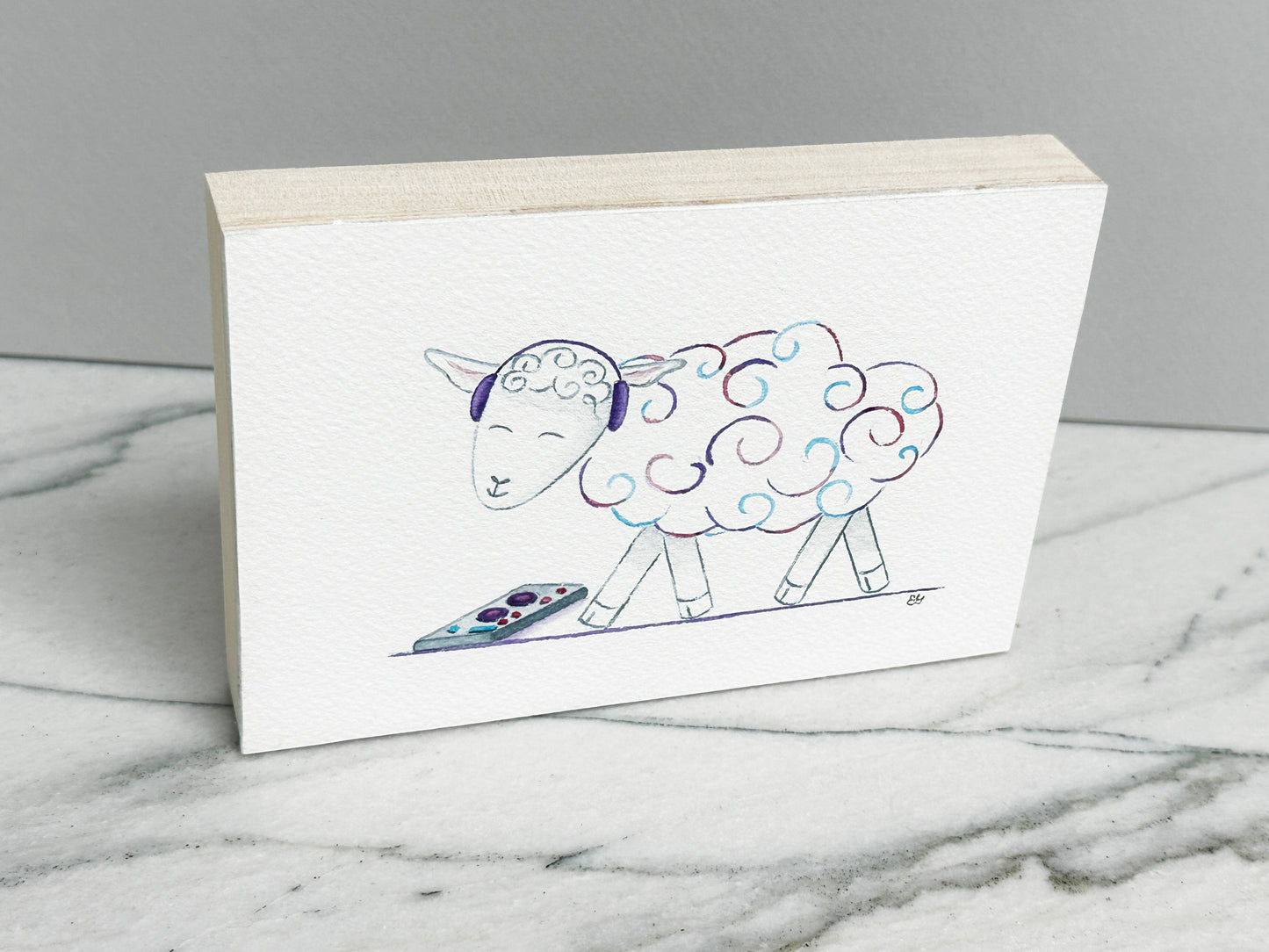 DJ Curlz the Sheep, an original watercolor painting of a sheep in headphones with pink and purple curls, mounted on a cradled wood panel, side view