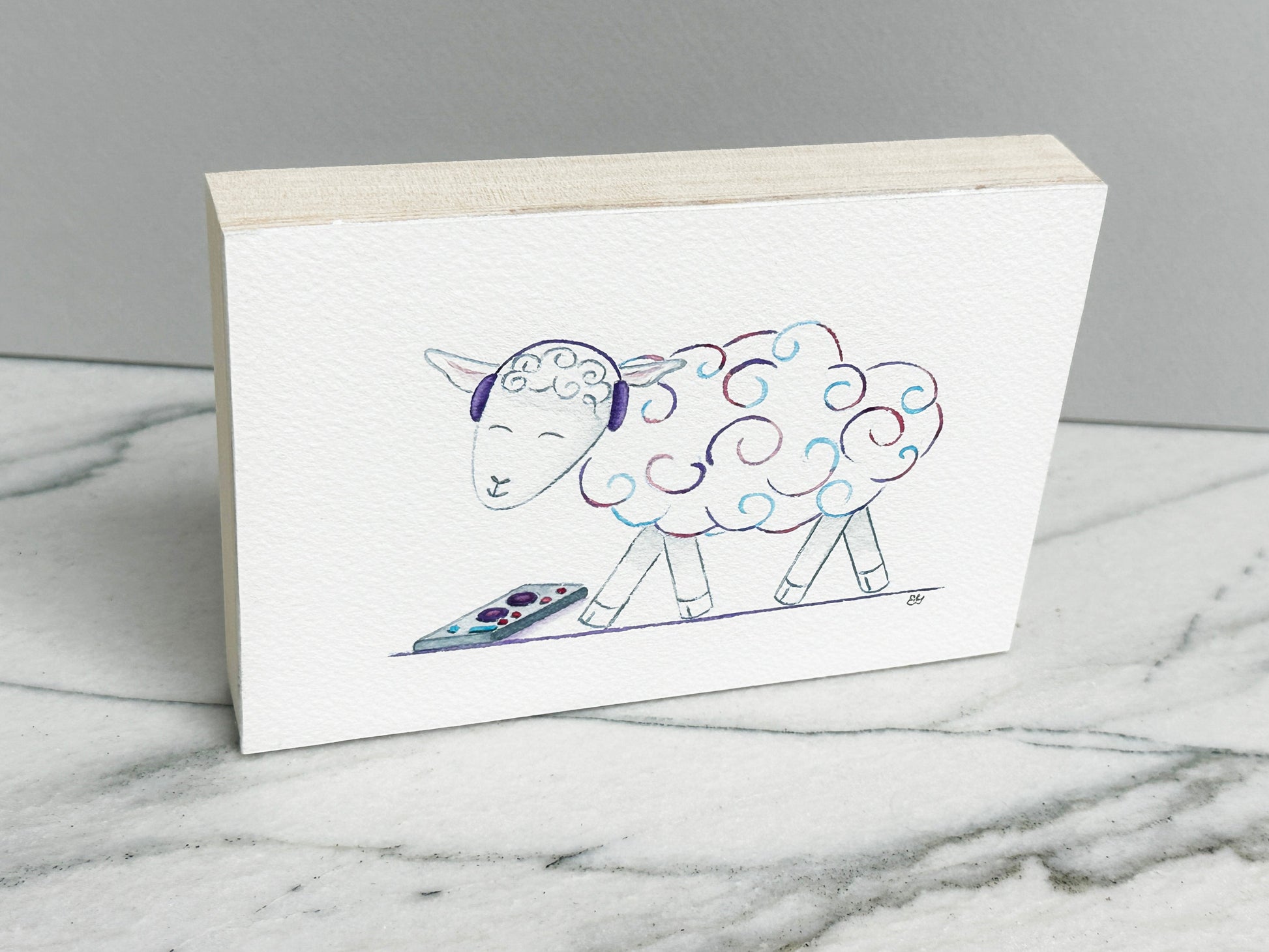 DJ Curlz the Sheep, an original watercolor painting of a sheep in headphones with pink and purple curls, mounted on a cradled wood panel, side view
